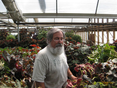 Lloyd Traven providing a tour of Peace Tree Farm's greenhouses. photo credit: A. Bunting