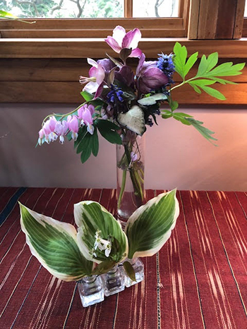 Two different size containers with arrangements